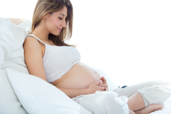 Portrait of pregnant woman relaxing at home.